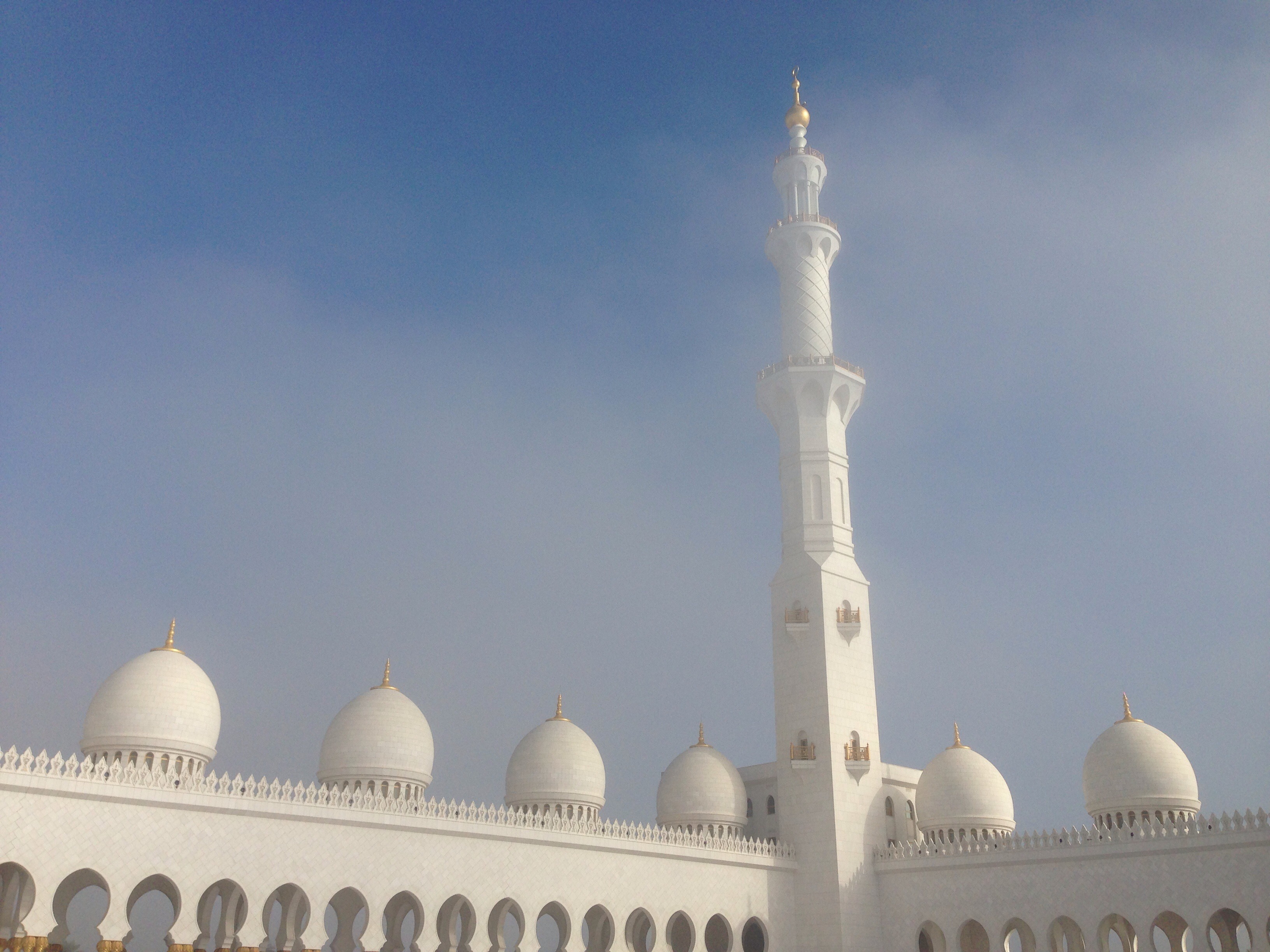 Tall white minaret above domes, uae, abu dhabi free image download