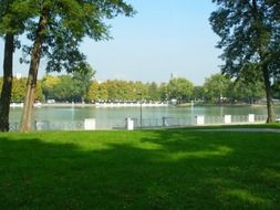 pond in park at sunny summer day