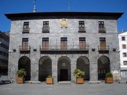 gray townhouse building with balconies in Azkoitia, Spain