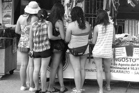 Black and white photo of the girls who are shopping