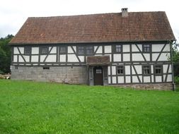 big country house among green grass