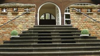 staircase near the entrance to the stone building