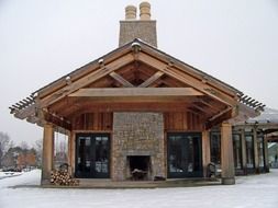building with a fireplace in winter