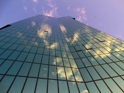 Mirroring of clouds on the sky on a skyscraper