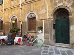 colored bicycle stands near the wall