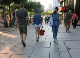 people walk along the pedestrian zone in the metropolis