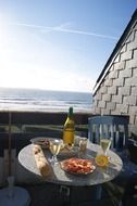Table with a meal on the beach on a sunny day