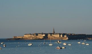 walled port in saint malo in the evening