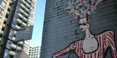 beautiful lady, mural on grey wall in city, canada, toronto