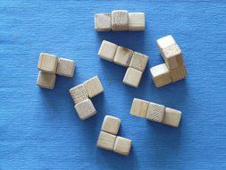 wooden puzzles toys on a blue surface