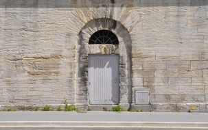 wooden door in an old stone building