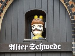 man’s head with animal mask, vintage wooden sculpture, germany, wismar