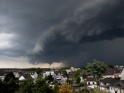 scenic dark stormy clouds sky above city, germany, troisdorf