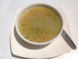 hot soup in a white bowl