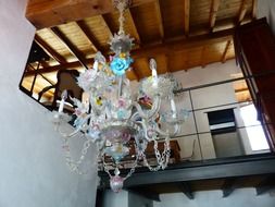 white chandelier in the living room in a house