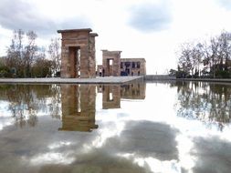 egyptian temple in park at pond, spain, madrid