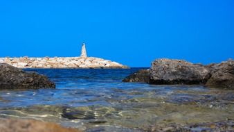 Lighthouse on a rock near the ocean