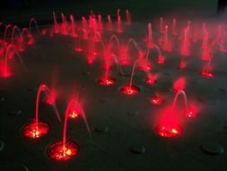 red light on the fountain at night