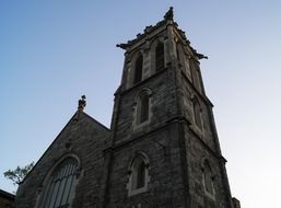 historic Stone church with a tower