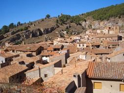 view of the spanish city near the green hill