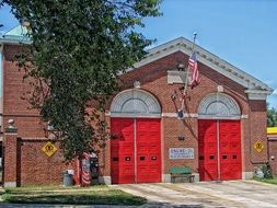 american flag on firehouse facade, usa, washington