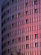 pink glass facade of the hotel