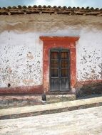 Old street door of an old village house