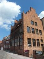 old red brick buildings on street, germany, wismar