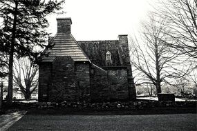 black and white picture of a stone house