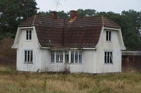 house with ghosts among nature in sweden
