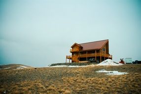 remote view of a wooden house on a hill in Montana