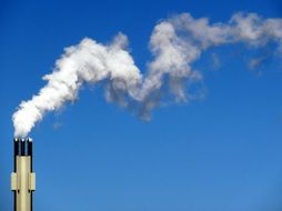 Smoke from a chimney against the sky