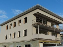 Unfinished building on the background of the clear sky