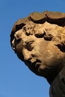 Face of old stone sculpture