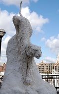 modern sculpture of leaping lion, uk, england, london