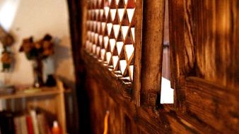 closeup picture of brown wood lattice on the window