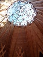 round glass dome in wooden roof construction