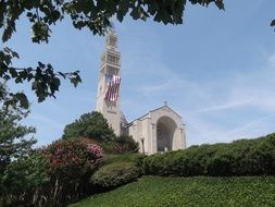 Basilica of the National Shrine of the Immaculate Conception in park at summer, usa, washington dc