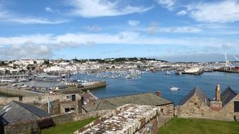 panoramic view of the harbor with boats on a sunny day