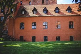 red brick building with green lawn