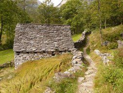 landscape of stone house and a nature trail