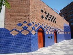 brick building with a blue pattern in amsterdam