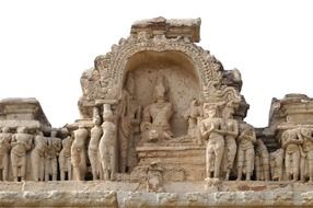 damaged ancient sculptures at top of temple, india, hampi