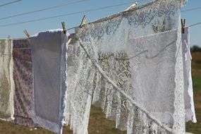 lace laundry hanging on line outdoor at summer