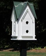 white birdhouse in the sun