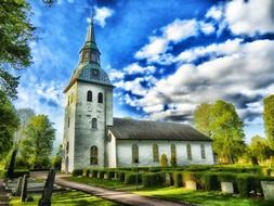 green trees near a church in sweden
