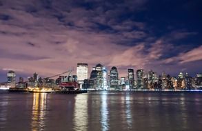 harbor and manhattan skyline at night, usa, nyc