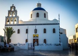 white church with bell tower on Santorini island, Greece