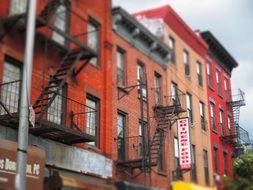 fire escape, metal external staircase on brick building, usa, nyc