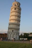 people looking at leaning tower in evening, italy, pisa